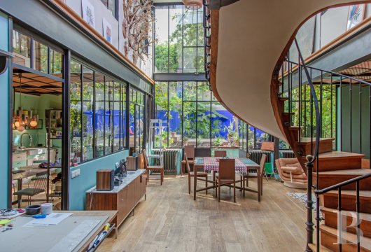 paris - An all-glazed industrial-style home designed like a multi-level penthouse, with four bedrooms,
 a 220m² floor area and a sun-kissed garden, in the suburban town of Montreuil beside Paris