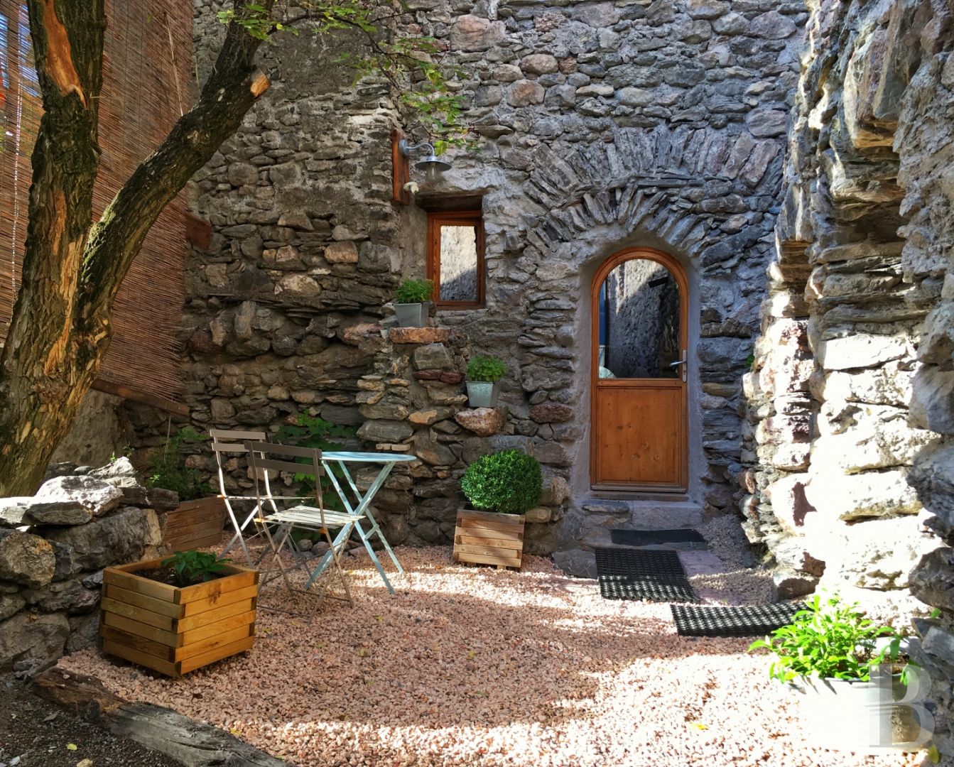 A former priory bathed in sunlight and surrounded by snowy mountain tops,  to the south of Briançon in the Hautes-Alpes - photo  n°12