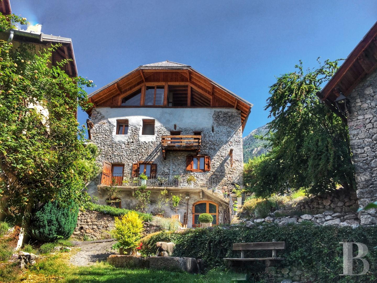 A former priory bathed in sunlight and surrounded by snowy mountain tops,  to the south of Briançon in the Hautes-Alpes - photo  n°10