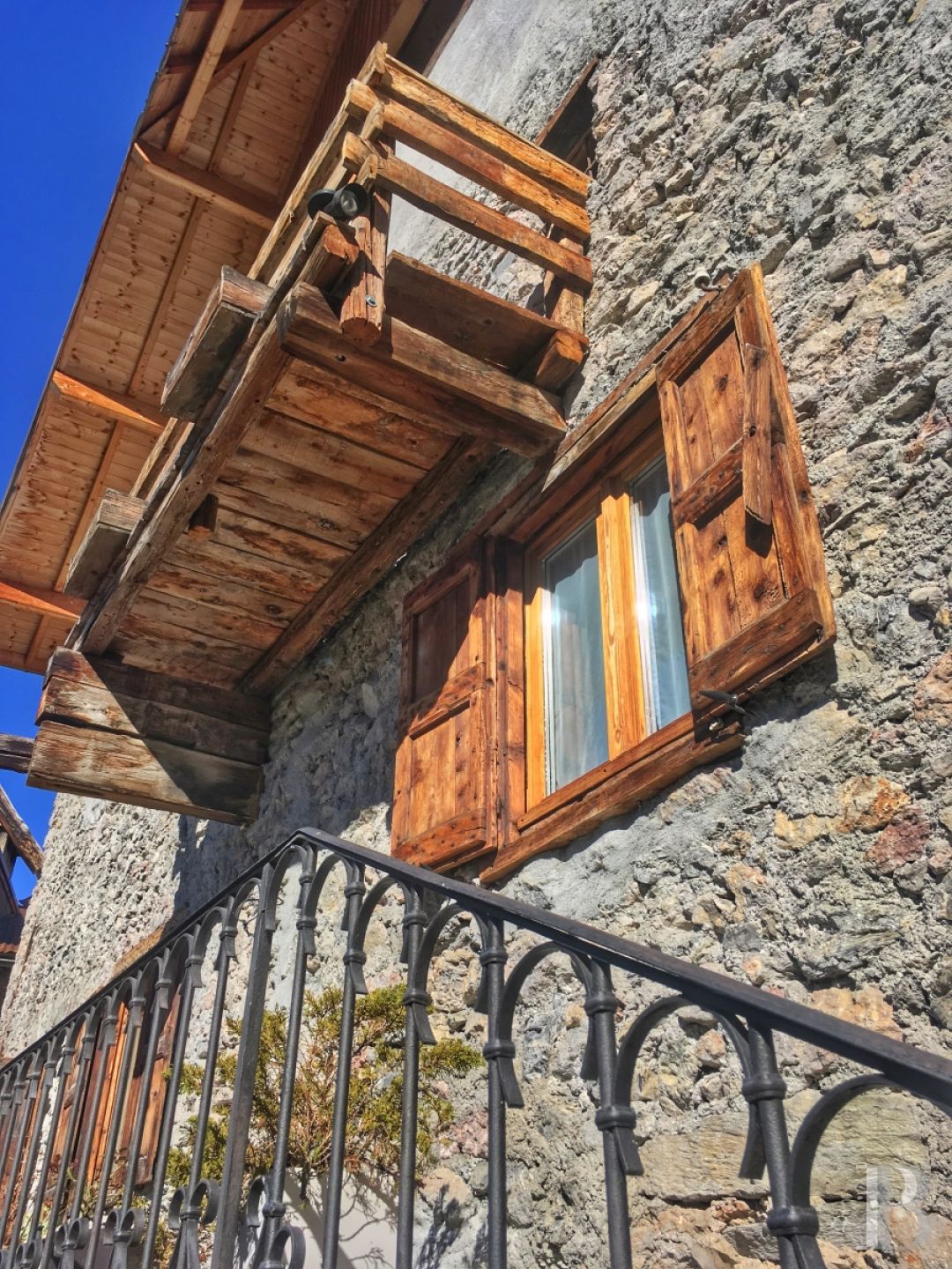 A former priory bathed in sunlight and surrounded by snowy mountain tops,  to the south of Briançon in the Hautes-Alpes - photo  n°9
