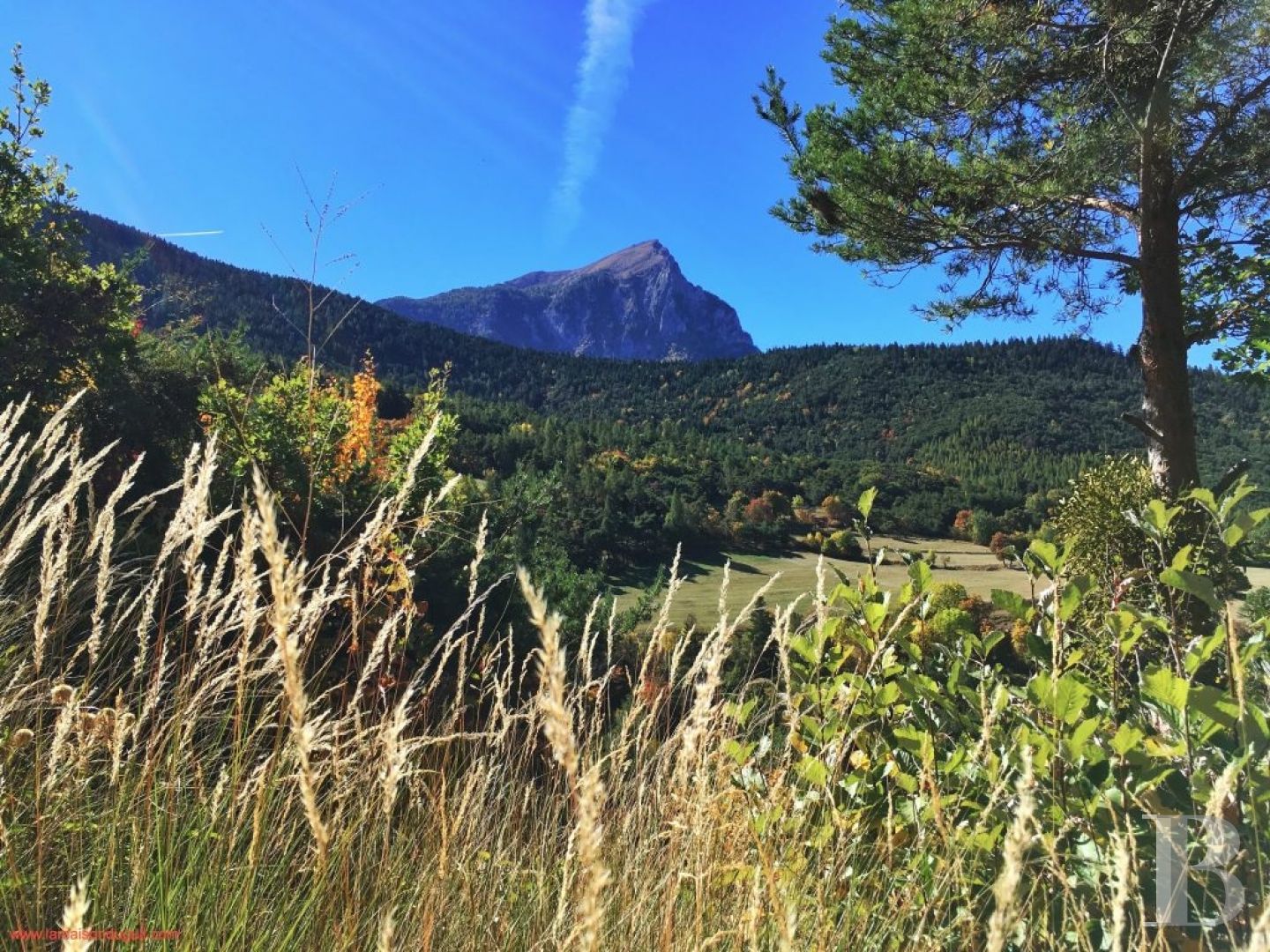 A former priory bathed in sunlight and surrounded by snowy mountain tops,  to the south of Briançon in the Hautes-Alpes - photo  n°7