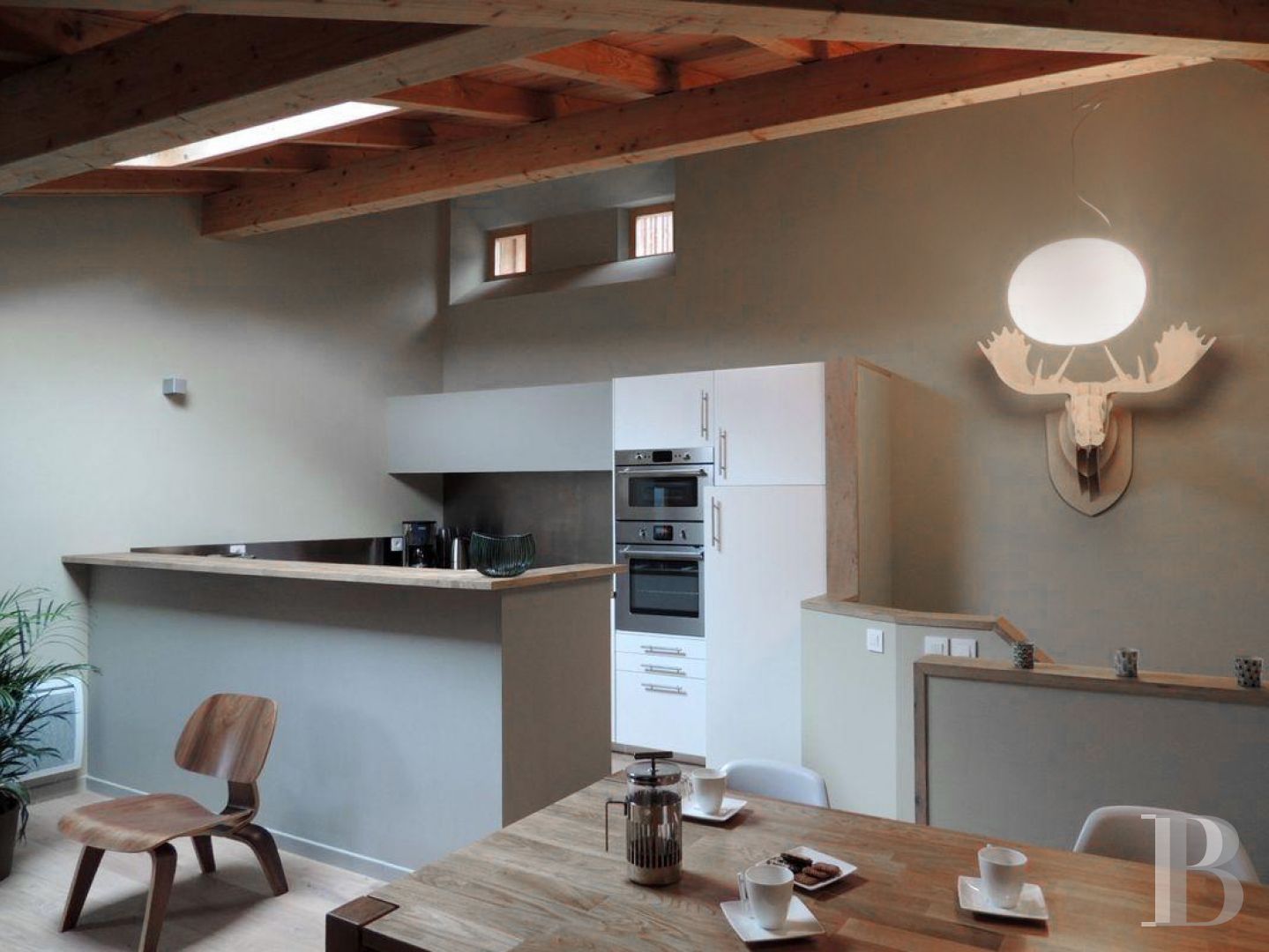 A former priory bathed in sunlight and surrounded by snowy mountain tops,  to the south of Briançon in the Hautes-Alpes - photo  n°18