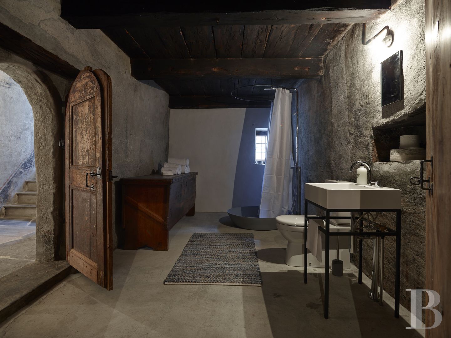 In Switzerland, in the canton of Graubünden, a baroque house and its tower in the heart of a mountain village - photo  n°6