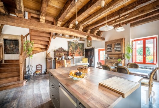 midi-pyrenees - An old stone house and shop nestled in one of France’s most beautiful villages with a view of a rocky cirque