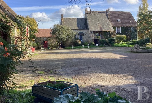 pays-de-loire - South of the Normandy-Maine Regional Park, a 15th century feudal manor house, its outbuildings and its pond 