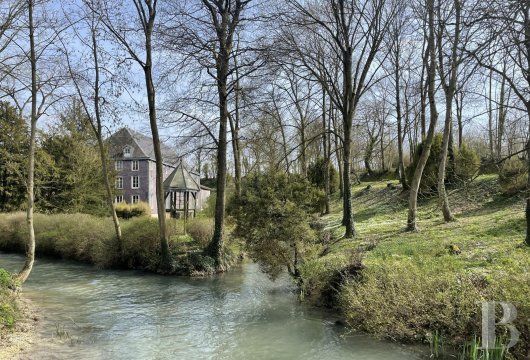 champagne-ardennes - A large watermill nestled in the valley of the River Moivre in France’s Champagne region