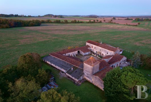 poitou-charentes - An early 17th century house requiring restoration, on the border between the Charente and  Dordogne with outbuildings set around a square courtyard, a dovecote and 8,500 m² of land