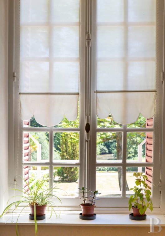 A manor house surrounded parkland and crossed by the River Sauldre in Romorantin, in the Sologne region - photo  n°18