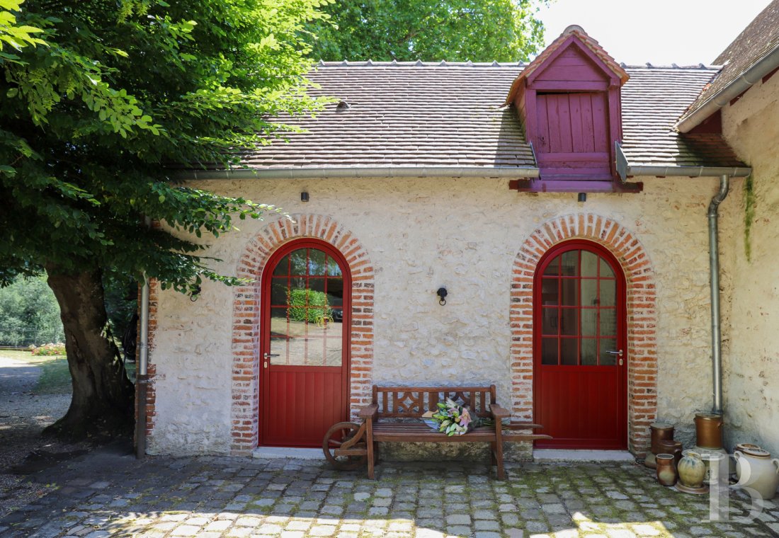 A manor house surrounded parkland and crossed by the River Sauldre in Romorantin, in the Sologne region - photo  n°29