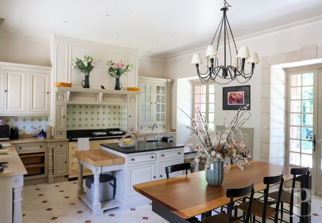 A manor house surrounded parkland and crossed by the River Sauldre in Romorantin, in the Sologne region - photo  n°9