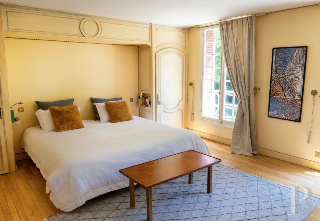 A manor house surrounded parkland and crossed by the River Sauldre in Romorantin, in the Sologne region - photo  n°13