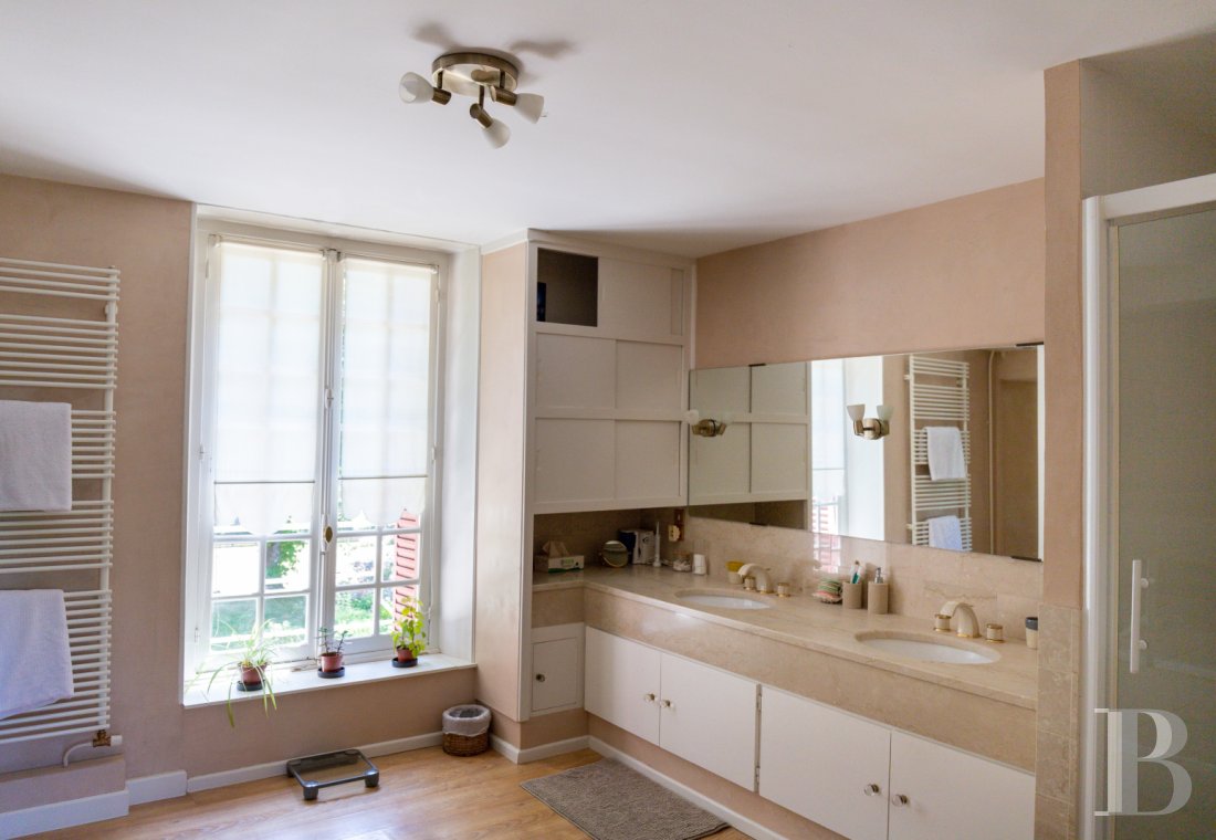 A manor house surrounded parkland and crossed by the River Sauldre in Romorantin, in the Sologne region - photo  n°17