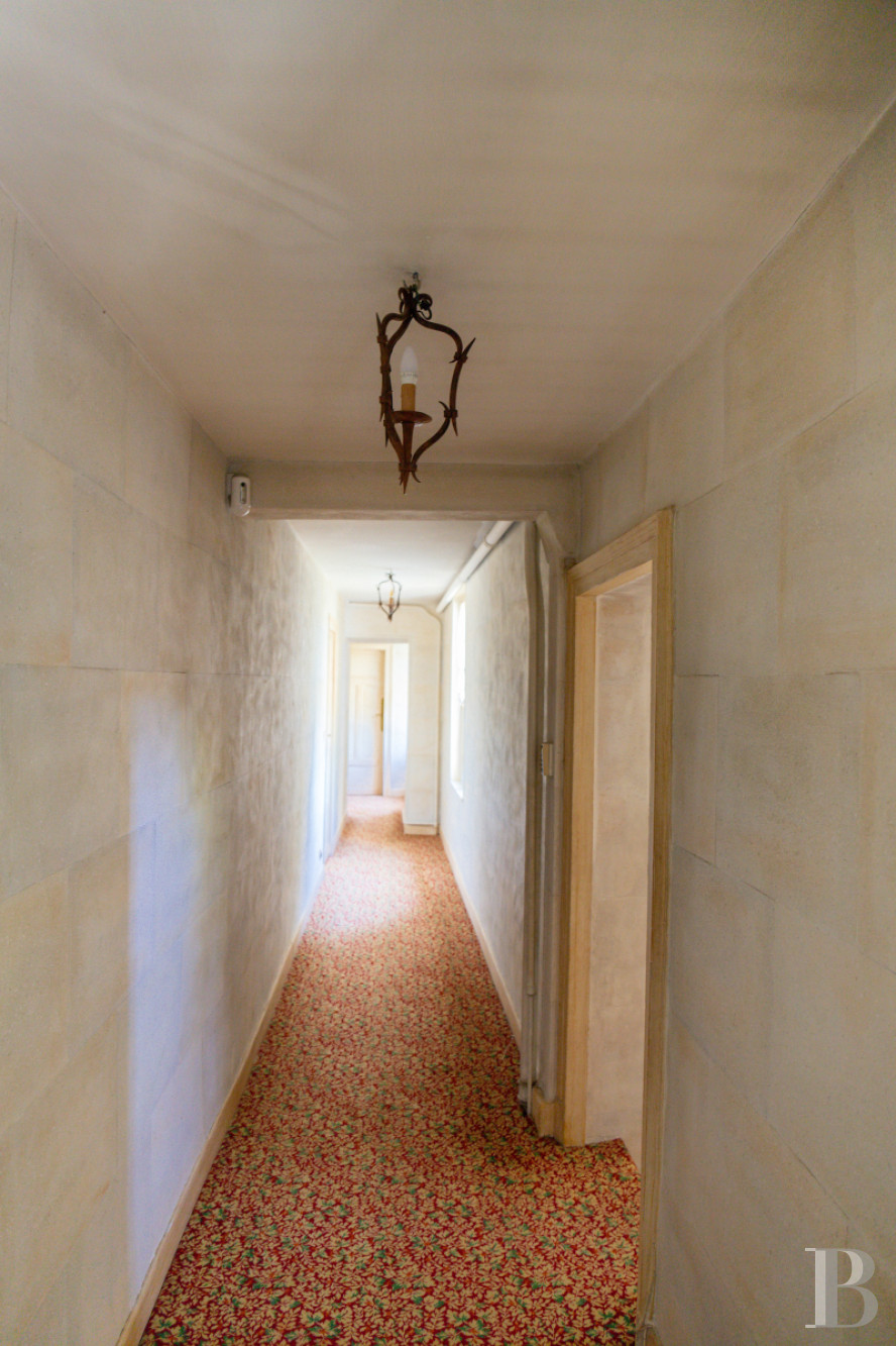 A manor house surrounded parkland and crossed by the River Sauldre in Romorantin, in the Sologne region - photo  n°15