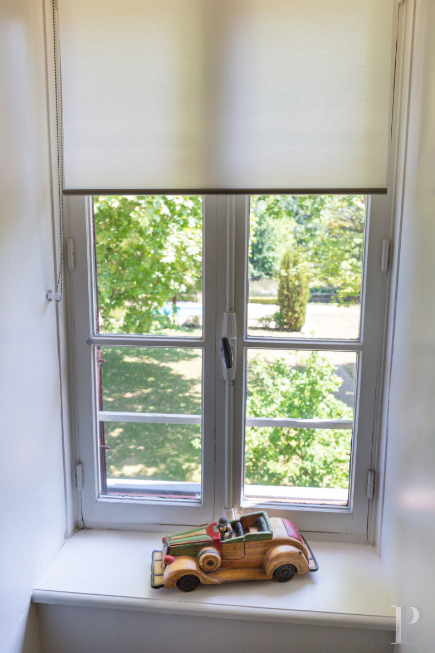 A manor house surrounded parkland and crossed by the River Sauldre in Romorantin, in the Sologne region - photo  n°21