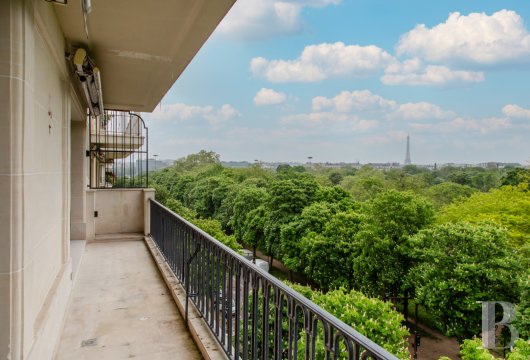 An apartment with a view of the treetops of Bois de Boulogne public park, nestled in Neuilly-sur-Seine, a delightful town in the western suburbs of Paris