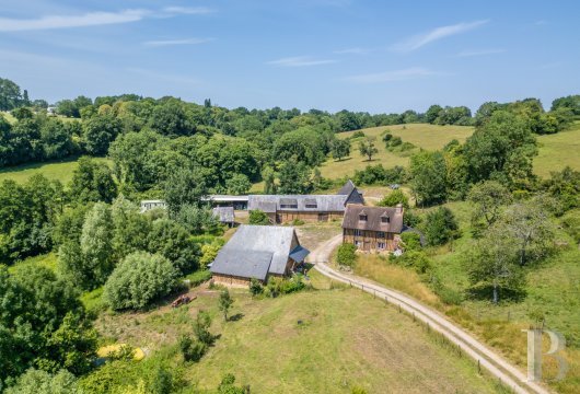 lower-normandy - An elegant, half-timbered house with large farm buildings,  nestled in the Pays d’Auge province of Normandy