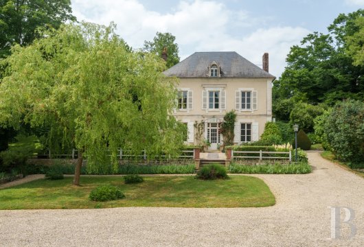 burgundy - An elegant manor house, surrounded by tree-filled grounds and  its many flowering plants, on the outskirts of a Burgundy village, two hours from Paris