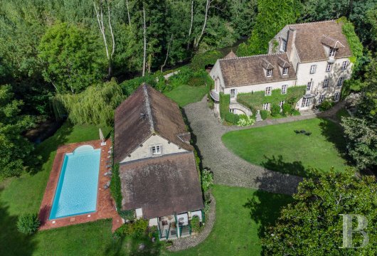 center-val-de-loire - A fully restored watermill, its verdant garden with a river, a swimming  pool, a caretaker’s cottage and a six-hectare poplar grove, in the Loiret countryside