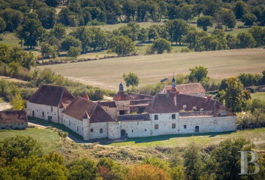 auvergne - In central France, in the Bourbonnais bocage, A listed 14th- and 17th-century farmhouse château with a riding arena, lake, and meadows, on 28 ha