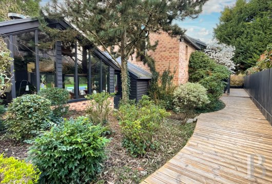 paris - A south-west-facing house with a pool and a 270m² floor area, on a private road by Saint-Nom-la-Bretèche golf course in France’s Yvelines department