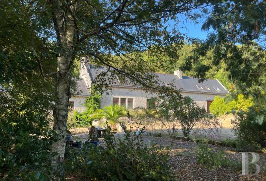 brittany - In southern Brittany, in a wooded valley near the ocean, within 1.5 ha A 420 m² rural estate with two dwellings and a multi purpose storage building